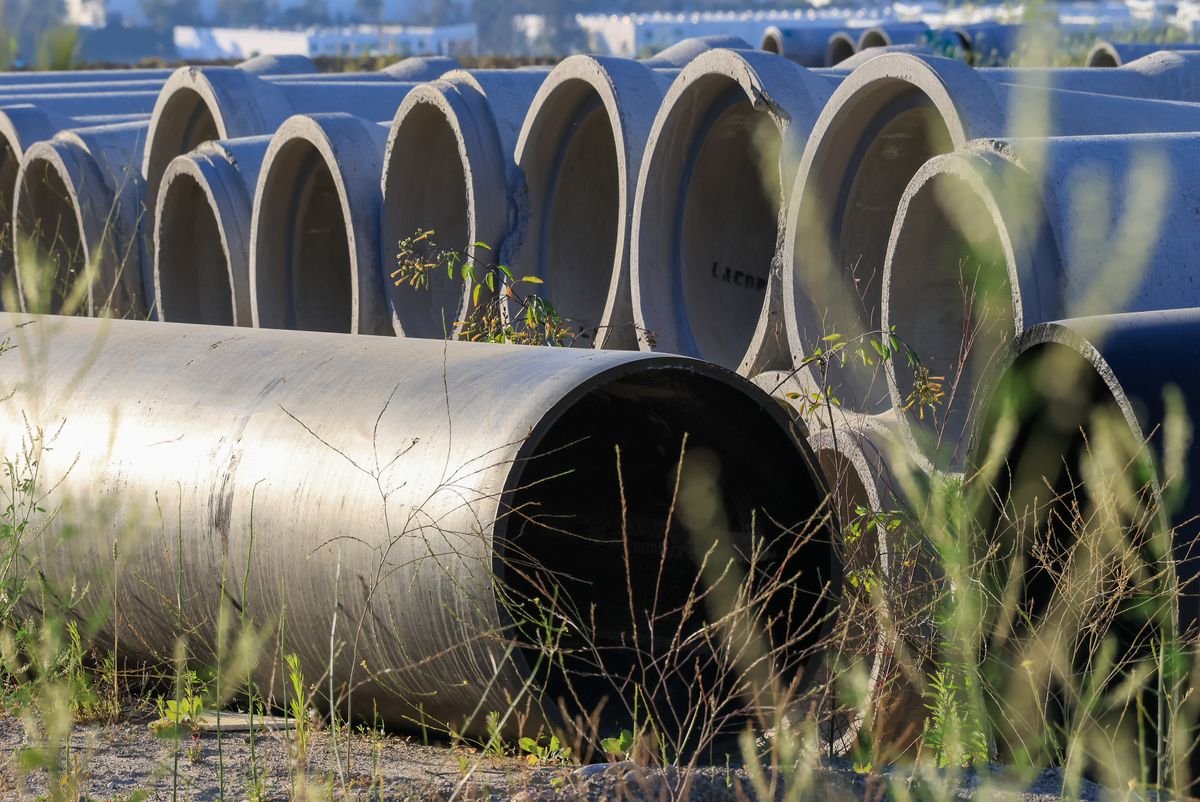 Concrete sewer pipe sections staged for replacement work